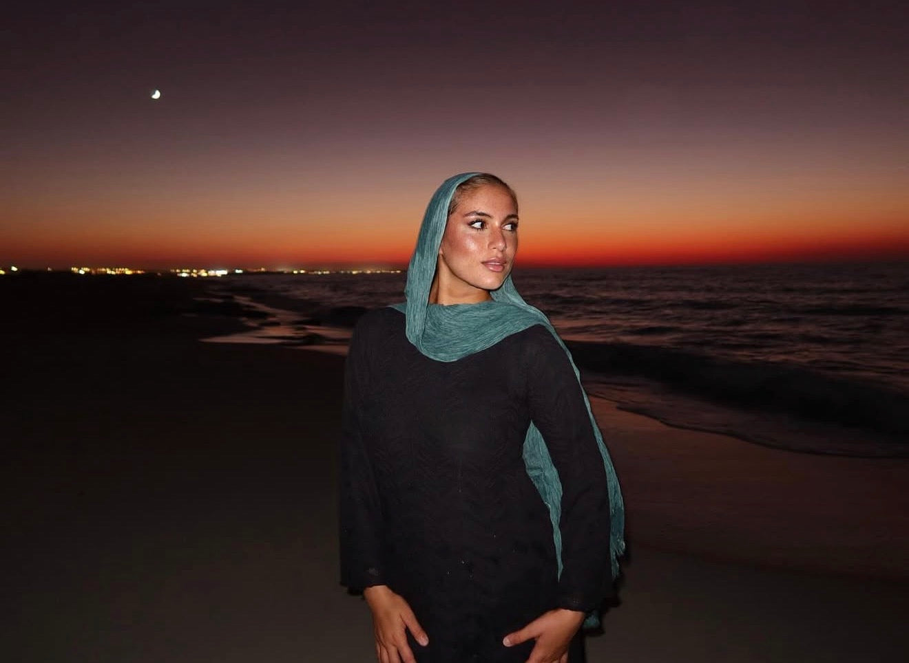 Woman in an elegant hijab and modest outfit on the beach at sunset - Leilah women's fashion